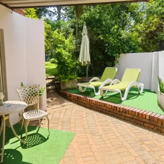 Outdoor Living Area with Barbecue at Andante Lodge in Pretoria